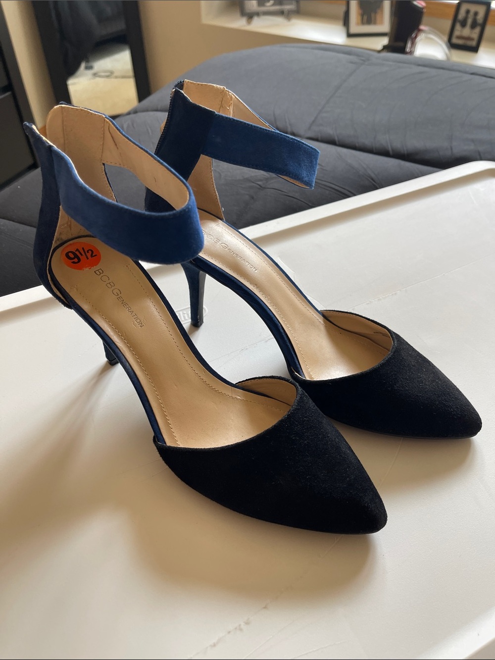 BCBGeneration Black Pointed-Toe Heels with Navy Ankle Strap
